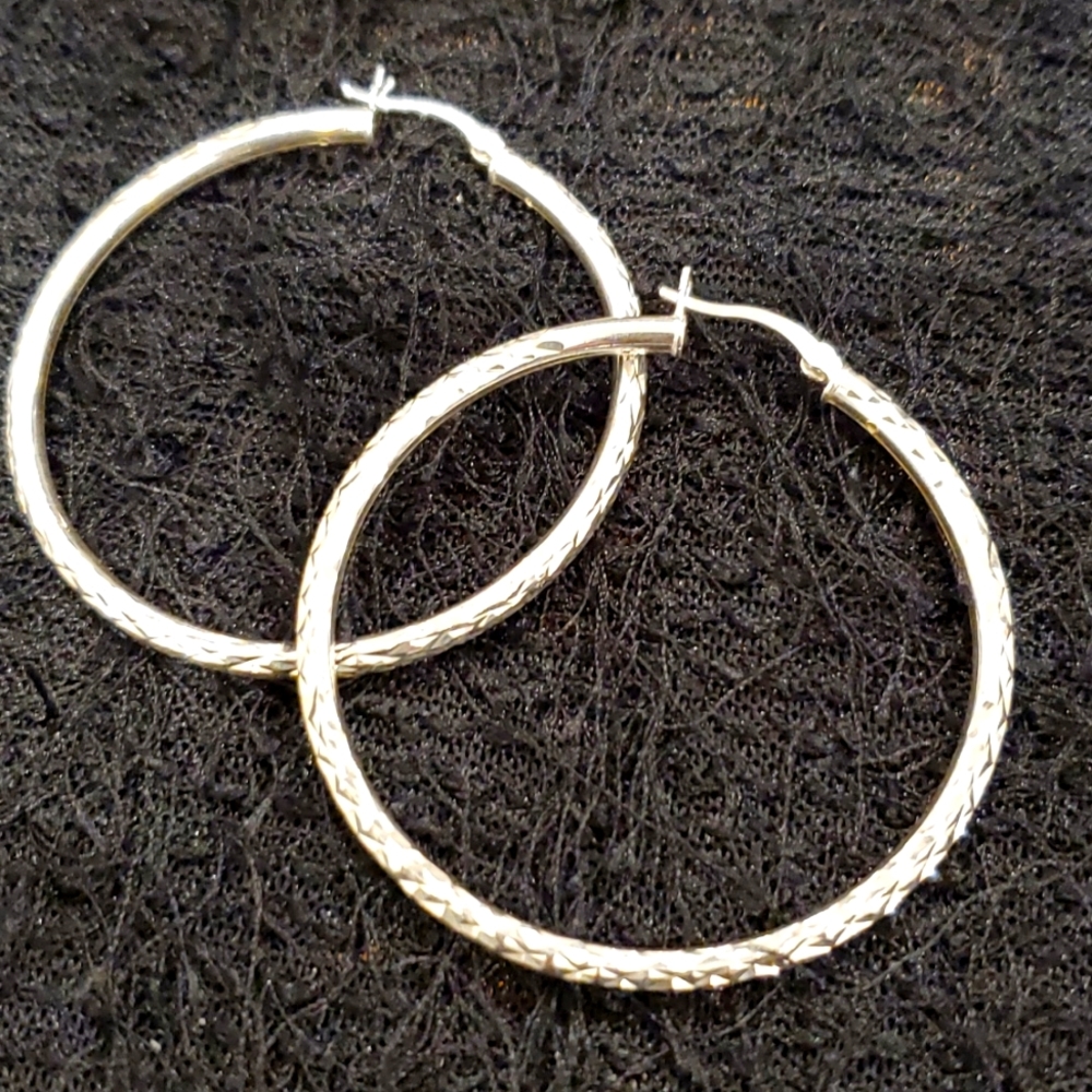 Diamond cut sterling silver hoops